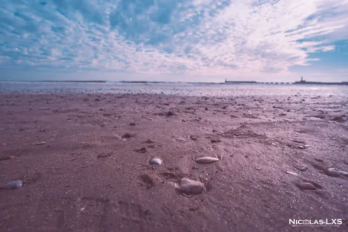Plage des Sables-d'Olonne à marée basse sous un ciel pommelé